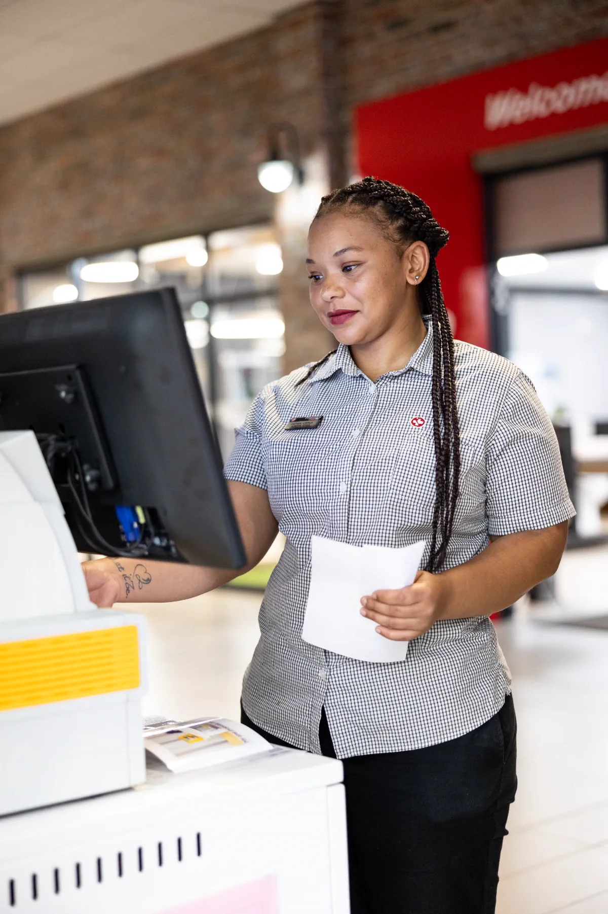 A member of the Albertyn team at the collection point just inside the SPAR centre entrance, a script in her hand